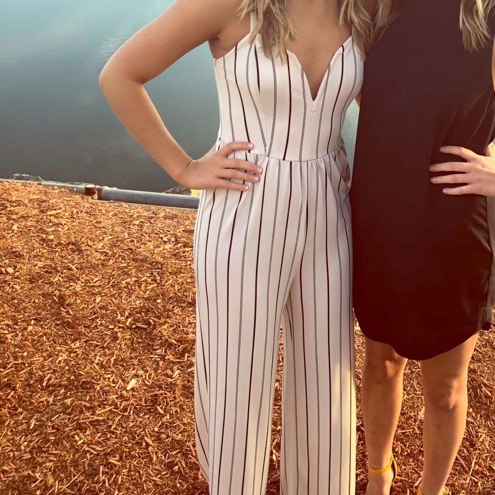 Cream colored jumpsuit with navy stripes
